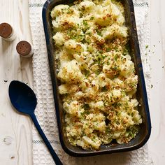 a casserole dish with broccoli and cheese