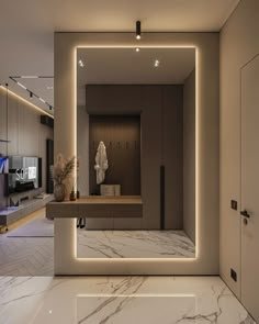 a modern bathroom with marble counter tops and lights on the wall, along with a large mirror