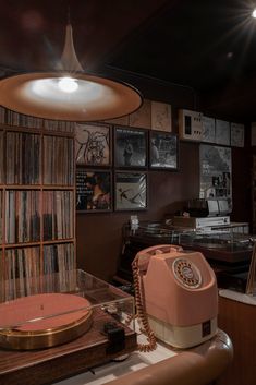 an old fashioned record player sitting on top of a table