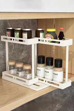 the spice rack is organized with spices and condiments on it's sides