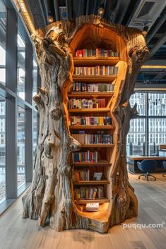 an unusual bookcase made out of tree trunks in the middle of a large room