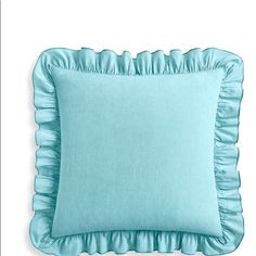 a light blue pillow with ruffled edges