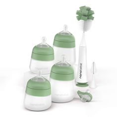 three baby bottles and an electric toothbrush