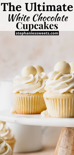 the ultimate white chocolate cupcakes with vanilla frosting on top are ready to be eaten