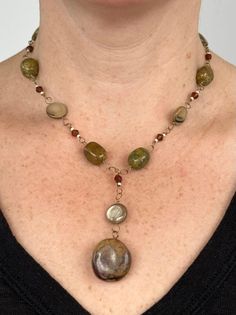 Handmade natural gemstone beaded necklace for person with a petite neck. This is an antiqued gold-tone single chain necklace comprised of polished light brown mother of pearl coin beads, faced brown plastic beads, natural polished green and brown agate gemstones. This beaded necklace has a pendant of a polished light brown mother of pearl coin beads and brown jasper gemstone, and is closed with a antiqued gold-tone toggle-clasp. This is a brown, mustard and hunter green handmade chunky necklace Handmade Stone Necklace, Making Necklaces With Beads, Green And Brown Outfit, Bohemian Beaded Jewelry, Brown Ocean, Etsy Necklace, Diy Wire Jewelry Rings, Earthy Necklace, 90s Jewelry