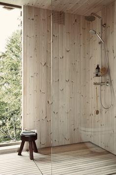 a bathroom with wooden walls and flooring