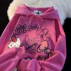 a pink hello kitty hoodie with white fur