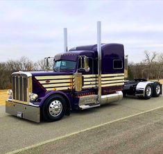 a large semi truck is parked on the side of the road