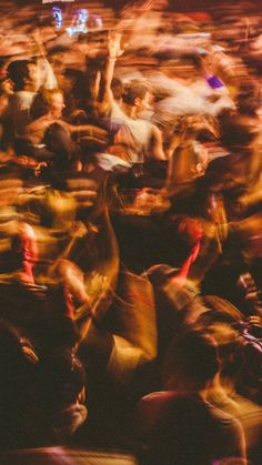 blurry photograph of people dancing at an event