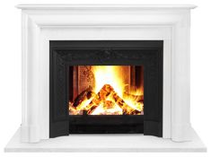 a white fireplace with a fire burning in it