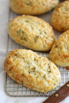 some type of bread that is cooling on a rack