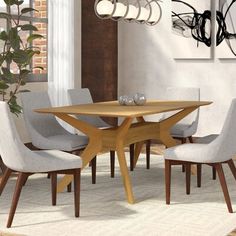 a dining room table with four chairs around it