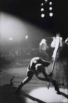 black and white photograph of a man on stage