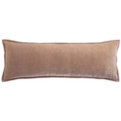 a brown velvet pillow on a white background