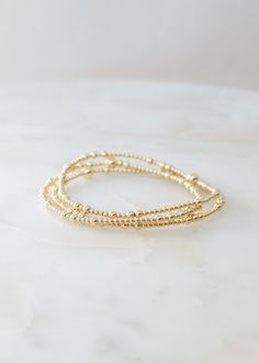 "❖Lisa Bracelet❖ * Simple, minimalistic, and yet uniquely stunning!  ‣ This listing is for a single bracelet or stack of 3.  ‣ Buy more, save more - applied at checkout      * 3 10% off      * 5, 15% off      * 7, 20% off ‣ Lisa bracelet features: * 2+3mm 14k Gold Filled Beads in random order * 1-5m 14k Gold Filled Bead Julisa Bracelets Feature:  ‣ Tight/Sturdy elastic, pre-stretched to prevent bracelet from stretching out ‣ Sizing according to wrist size ‣Sizing Tips:  Please measure your wrist for the best fit!  *Using a soft tape measure/string, measure around your wrist, above the wrist bone *Add length according to your desired fit:       * 0\" - fitted, snug      * .25\" - slight movement      * .5\" -  relaxed      * .75\"- loose      * 1\" - extra loose *Please message us if you ne Lisa Bracelet, College Wishlist, Pre College, Bead Bracelet Stack, Pink Gold Jewelry, Gold Bracelets Stacked, Single Bracelet, Bracelet For Her, Preppy Jewelry