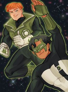 two young men dressed as green lantern and the man in black is holding his hands up