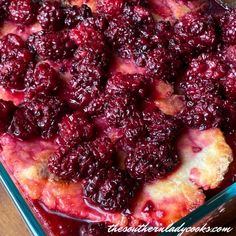 a close up of a casserole in a pan on a table with fruit