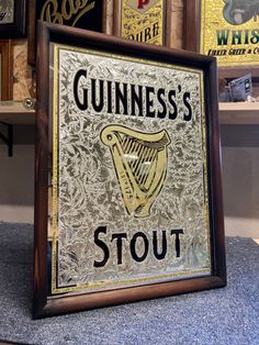 Guinness's stout Irish pub mirror .  Reverse painted black lettering . Chipped glass gilded in 12kt white goldleaf and 22kt goldleaf .  The harp is gilded in 18kt goldleaf . Mounted in a traditional pine bullnose frame aged stained an sealed in .  It measures 32.5cm wide 42.5cm high 4cm thick .  Mounting brackets included .  Truly stunning piece for any Irish themed bar !  Extremely well packed and crated for world wide shipping . Pub Mirror, The Harp, Sign Painting, Reverse Painted, Irish Pub, Mounting Brackets, Guinness, Harp, Painted Signs