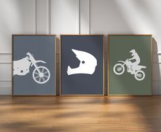 three framed posters with dirt bike silhouettes on them in front of a wooden floor