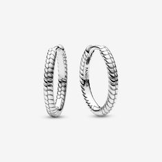 Create an instantly iconic look with the Pandora Moments Small Charm Hoop Earrings. These sterling silver earrings feature Pandora's famous snake chain pattern. These hoop earrings have a diameter of 18 mm, compared to the existing 25 mm style, and can hold one charm or dangle charm. Sleek on their own or personalized when paired with your favorite charms, these hoops are a style win. Please note that due to the smaller size and thickness of the hoops, some charms may not fit on these earrings. - Pandora Moments Small Charm Hoop Earrings - Sterling silver Earrings Pandora, Pandora Earrings, Charms Pandora, Chain Pattern, Mesh Bracelet, Small Charms, Dangle Charms, Bracelets And Charms, Snake Chain