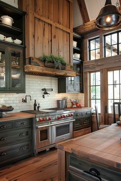 a kitchen with wooden floors and cabinets in the center, along with an island countertop