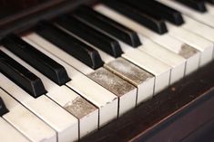 an old piano with black and white keys