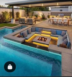 an outdoor living area with a fire pit and patio furniture next to a swimming pool