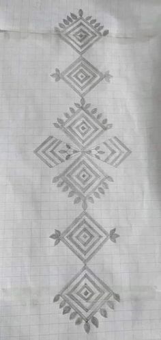 an artistic pattern is shown in the middle of a piece of paper with squares and diamonds on it