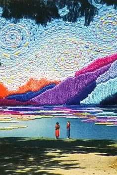 two people standing in front of a lake under a sky filled with swirls and stars