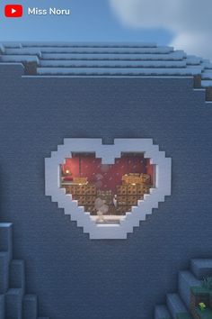 a heart shaped window in the middle of a building