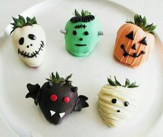 four halloween treats are arranged on a plate