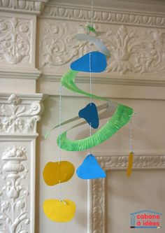 a colorful wind chime hanging from a ceiling