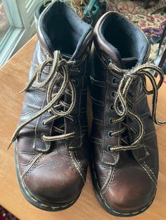 "Doc Marten's chukka boots Vintage brown leather heavily stitched lace up thick year round Hip mod retro grunge thick brown leather boots UK 11 US 11.5. Good vintage condition-some wear on insoles and laces both easily replaced, otherwise miles to go on these classic boots. The back pull tab appears to have been cut off but does not detract from these great boots. Outside heel to toe 13\" Width at ball 4 1/2\" Heel 1/2\" Sole 1\" Shaft side 5 1/4\" Back 3 1/2\" 7 hole laces ( will include new 54 Brown Ankle Work Boots For Streetwear, Brown Ankle Work Boots, Brown Round Toe Work Boots For Streetwear, Retro Lace-up Leather Boots, Vintage Brown Martin Boots For Outdoor, Vintage Work Boots With Leather Footbed For Outdoor, Brown Boots With Reinforced Toe For Streetwear, Brown Ankle-high Work Boots For Streetwear, Brown Round Toe Boots For Streetwear