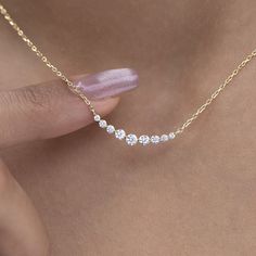 Elevate your style with our dainty 14k Curved Bar Diamond Necklace. This minimalist and handcrafted piece features a delicate bar pendant adorned with sparkling diamonds, making it the perfect wedding gift for her. Embrace the elegance and timeless beauty of this handmade diamond jewelry. Order now and make a statement of sophistication! Alternatively, choose from our options of natural, lab-grown diamonds or dazzling moissanites at three different price points to fit your unique preferences and budget. Please check below to see specifications of each stone option. Each piece is accompanied by an Azalea Certification and Warranty document, ensuring that you receive a high-quality, authentic piece of fine jewelry. Please message us if you don't receive your certification with your piece. M Luxury Minimalist Diamond-shaped Jewelry, 3 Diamind Necklace Horizontal, Diamond Necklaces Design, Luxury Dainty Diamond Necklace With Baguette Diamonds, Lab Diamond Necklace, Everyday Diamond Jewelry, Silver Dainty Diamond Necklace, Minimal Diamond Necklace, Diamond Simple Necklace