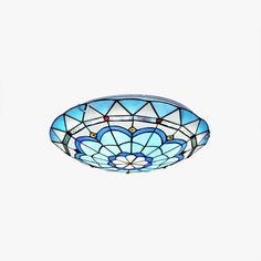 a stained glass bowl hanging from the ceiling