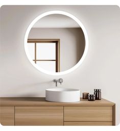 there is a round mirror on the wall above a bathroom sink and counter with bottles