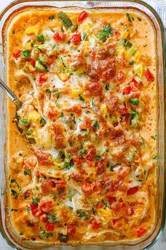 a casserole dish filled with vegetables and cheese