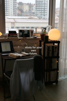 there is a desk with a laptop on it in front of a window that reads study for your own future