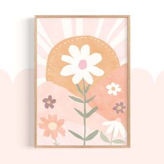 a pink and white flower print hanging on a wall next to a wooden frame with the word