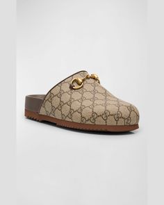 Find GUCCI Gg Supreme Horsebit Mules on Editorialist. Gucci mule slippers in GG Supreme canvas Flat heel Round toe Goldtoned horsebit hardware Slide style Rubber outsole Made in Italy Italy, Heels, Slippers, Gucci Clogs, Gucci Mule, Canvas Flats, Gucci Mules, Mule, Gucci