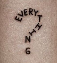 the word everything is written in cursive writing on someone's arm and leg