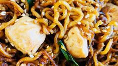 close up view of noodles with chicken and vegetables