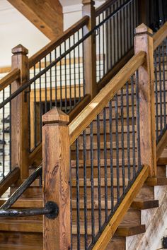 an iron and wood stair railing in a home