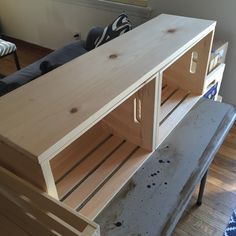 an unfinished entertainment center in the middle of a living room