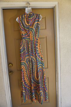 "Vintage 1970s maxi dress. No tags fits like a Large. In good vintage condition. no stains, holes, or tears. Please see measurements. Measurements taken across front lying flat 19\" across front armpit to armpit 14\" across front of empire waist 17\" across natural waist 55\" length" 1970s Style Multicolor Maxi Dress, 1970s Fitted Multicolor Maxi Dress, 1970s Style Fitted Multicolor Maxi Dress, 1970s Fitted Sleeveless Maxi Dress, Retro Print Maxi Dress For Summer, Retro Summer Floor-length Maxi Dress, Retro Floor-length Maxi Dress For Summer, Vintage Multicolor Sleeveless Maxi Dress, 70s Inspired Fitted Maxi Dress