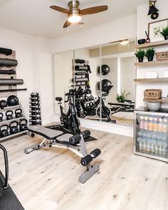 a home gym with exercise equipment and mirrors