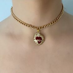 Are you looking for the perfect necklace for this fall season? My red and gold sacred heart choker necklace is a unique piece of handmade jewelry to wear and to gift! Inspired by my love for sacred heart jewelry and unique anniversary gift ideas, my thick gold chain choker necklace is the perfect compliment to any outfit idea. My red heart choker is a great gift idea for any special occasion to all the women in your life! You can't go wrong when gifting my Mexican heart necklace to your mother, Vintage Choker Jewelry For Valentine's Day, Valentine's Day Gift Choker With Clavicle Chain, Valentine's Day Gift Clavicle Chain Choker, Red Heart Charm Choker Necklace, Vintage Valentine's Day Choker, Vintage Heart Charm Choker Jewelry, Vintage Heart Charm Choker, Valentine's Day Heart Pendant Choker With Clavicle Chain, Valentine's Day Heart Pendant Clavicle Chain Choker