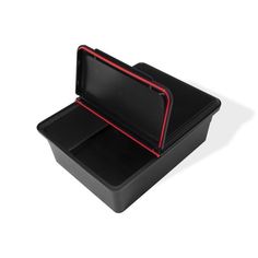 an open black box with red trims on the lid and bottom, sitting on a white surface