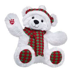 a white teddy bear wearing a red and green scarf