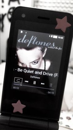 an mp3 player is sitting on top of a bed with the caption delfonces be quiet and drive if